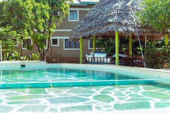 Pool and makuti gazebo at Maweni Christian Guest House